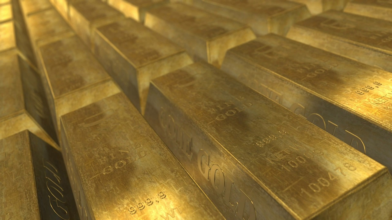 Sztabki złota symbolizujące zasoby finansowe i stabilność budżetową Rosji.