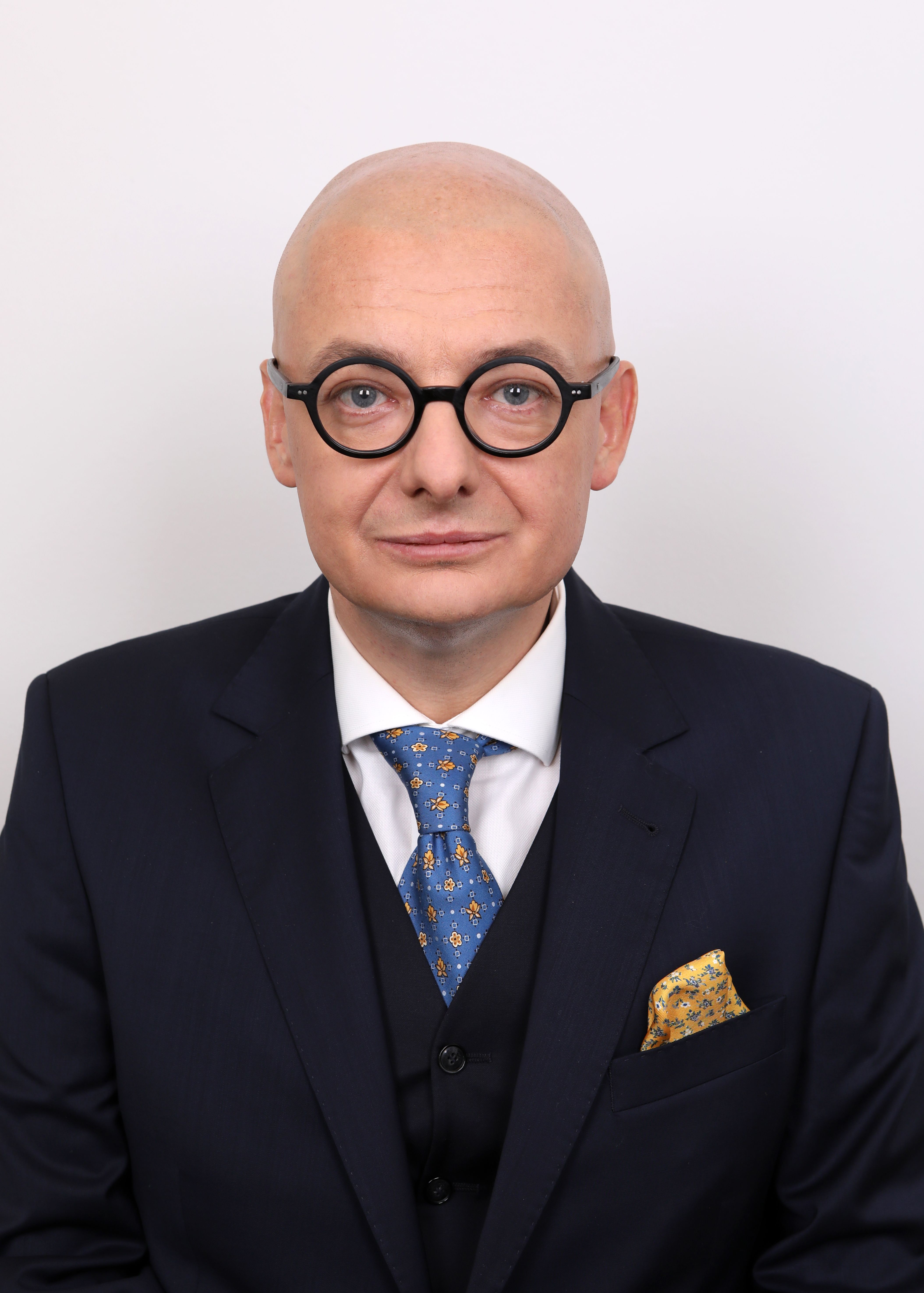 Michał Kamiński, wicemarszałek Senatu, w garniturze i z okularami.