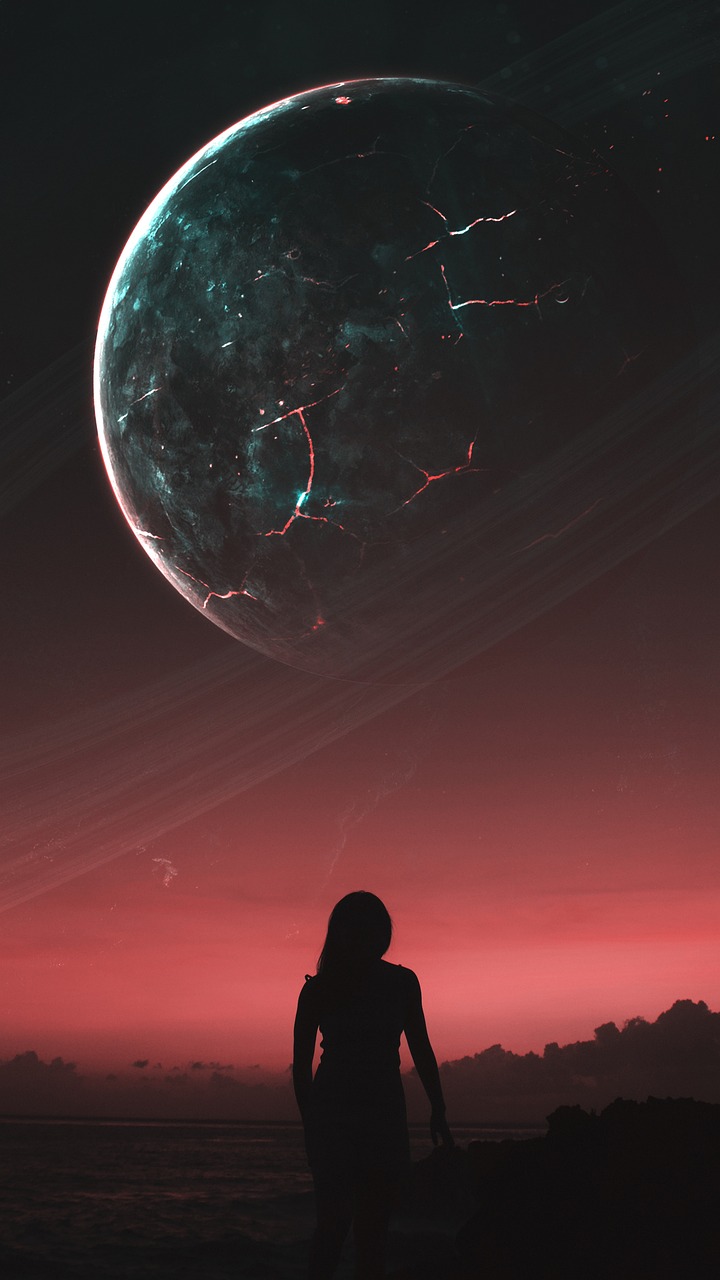 Sylwetka kobiety patrząca na planetę z pierścieniami, symbolizującą wpływ Wenus na miłość i pieniądze.