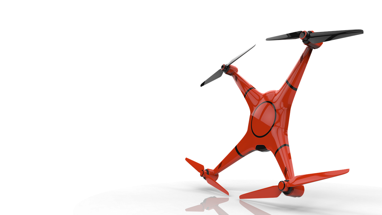 Pomarańczowy dron FPV w locie, symbolizujący nowoczesną technologię w konfliktach zbrojnych.